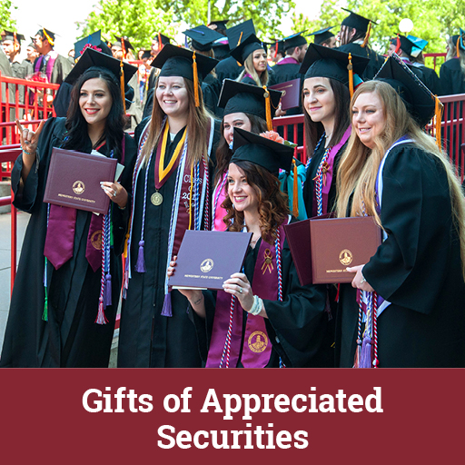 Photo of graudates holding their diplomas. Links to Gifts of Appreciated Securities
